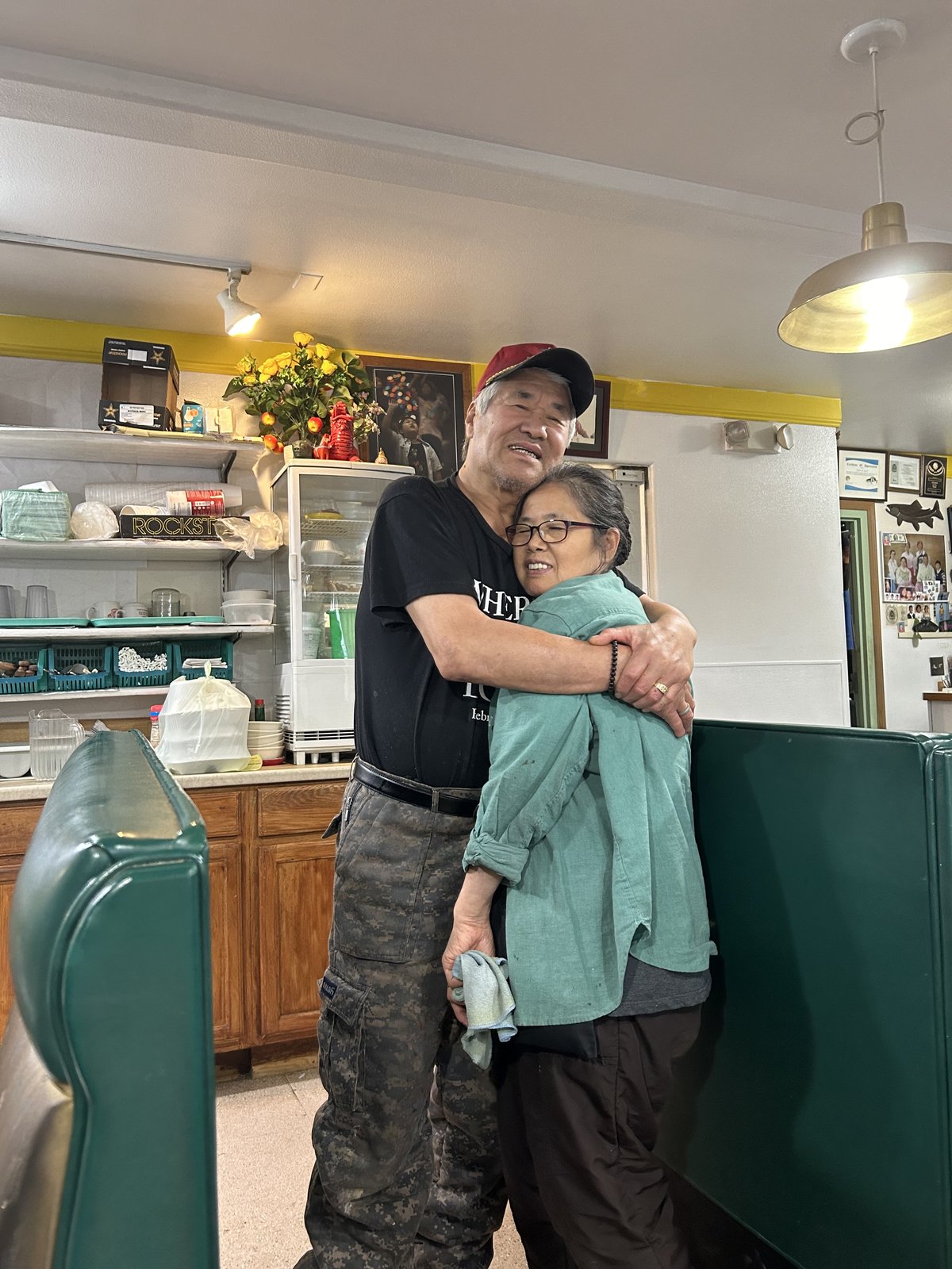 Mr. and Mrs. Kim standing in the restaurant