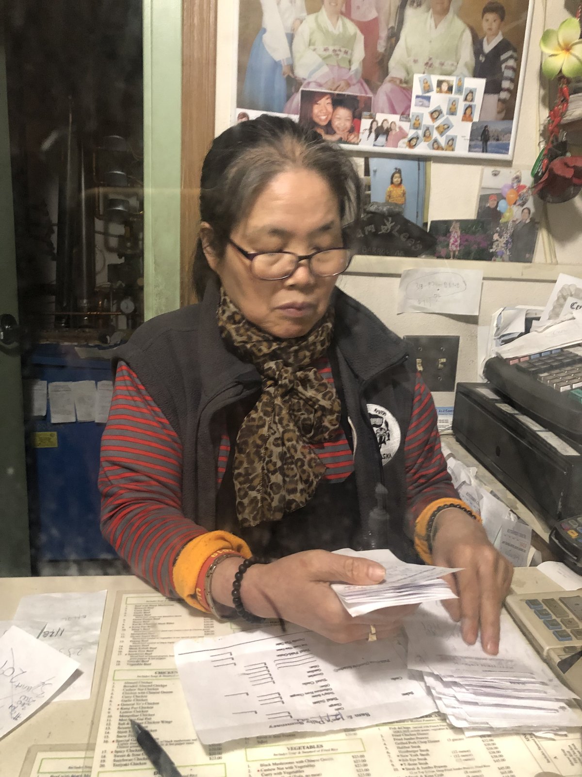 Mrs. Kim working at the front counter
